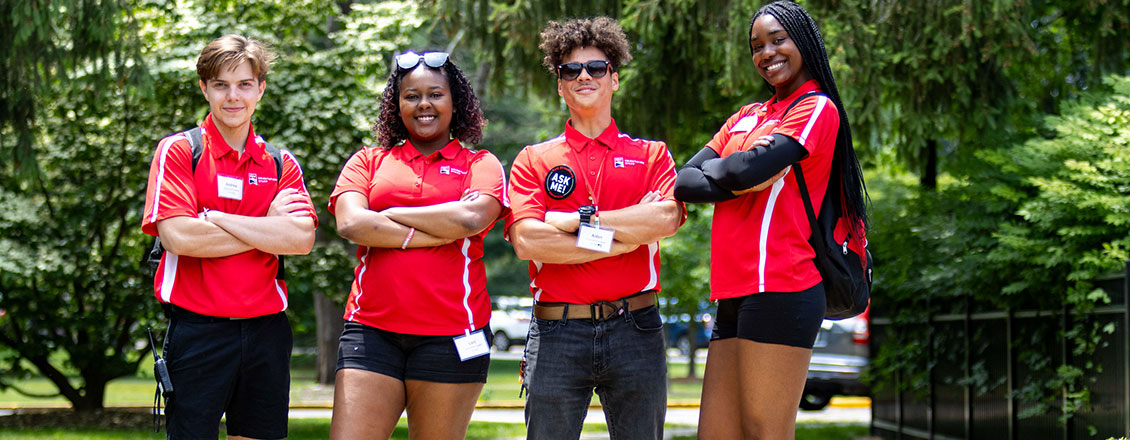 orientation leaders dressed in red and black